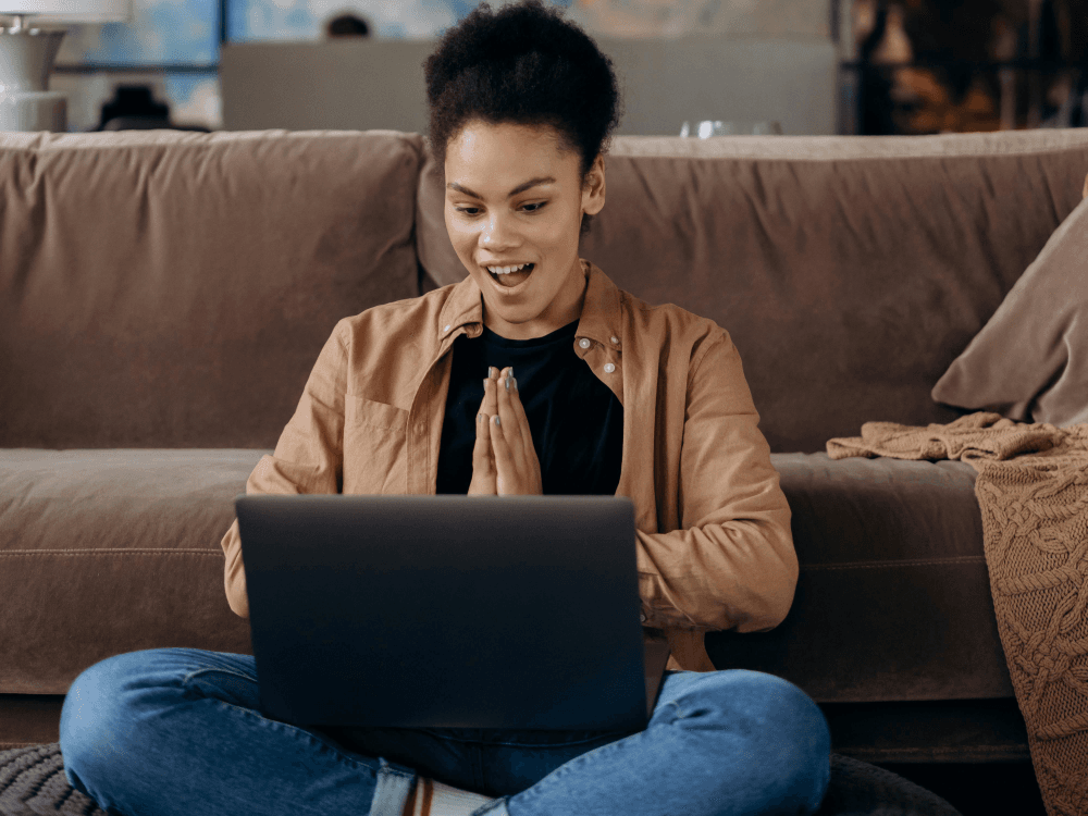 A Canadian woman with a happy expression as she used an AI prompt to save some money for herself.