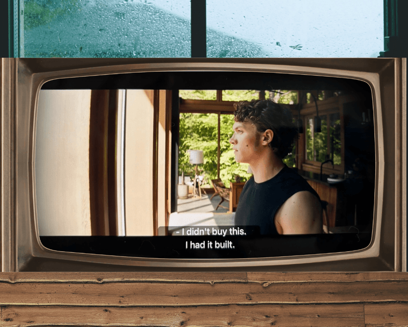 A scene from Heated Rivalry, with the character Ilya Rozanov on a cottage TV, saying, "I didn't buy this, I had it built."