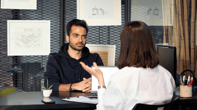 A Canadian woman negotiating a pay increase with her potential boss.