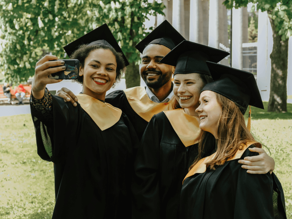 A group of Canadian graduates, excited for the next stage of their life: earning money. Find out if you need a university degree to be well-off in Canada.