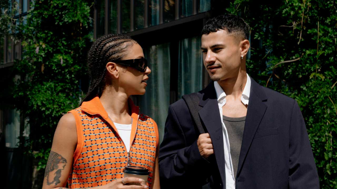 Two Canadians debating if an emergency fund is worth sitting in a savings account or if it should be put into investing for better returns.