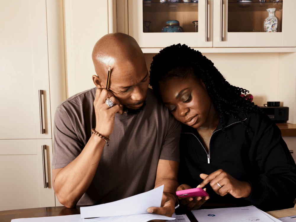 A Canadian man seated in his kitchen, wondering if he's over paying on his utilities bills, including heat, hydro, water and electricity.
