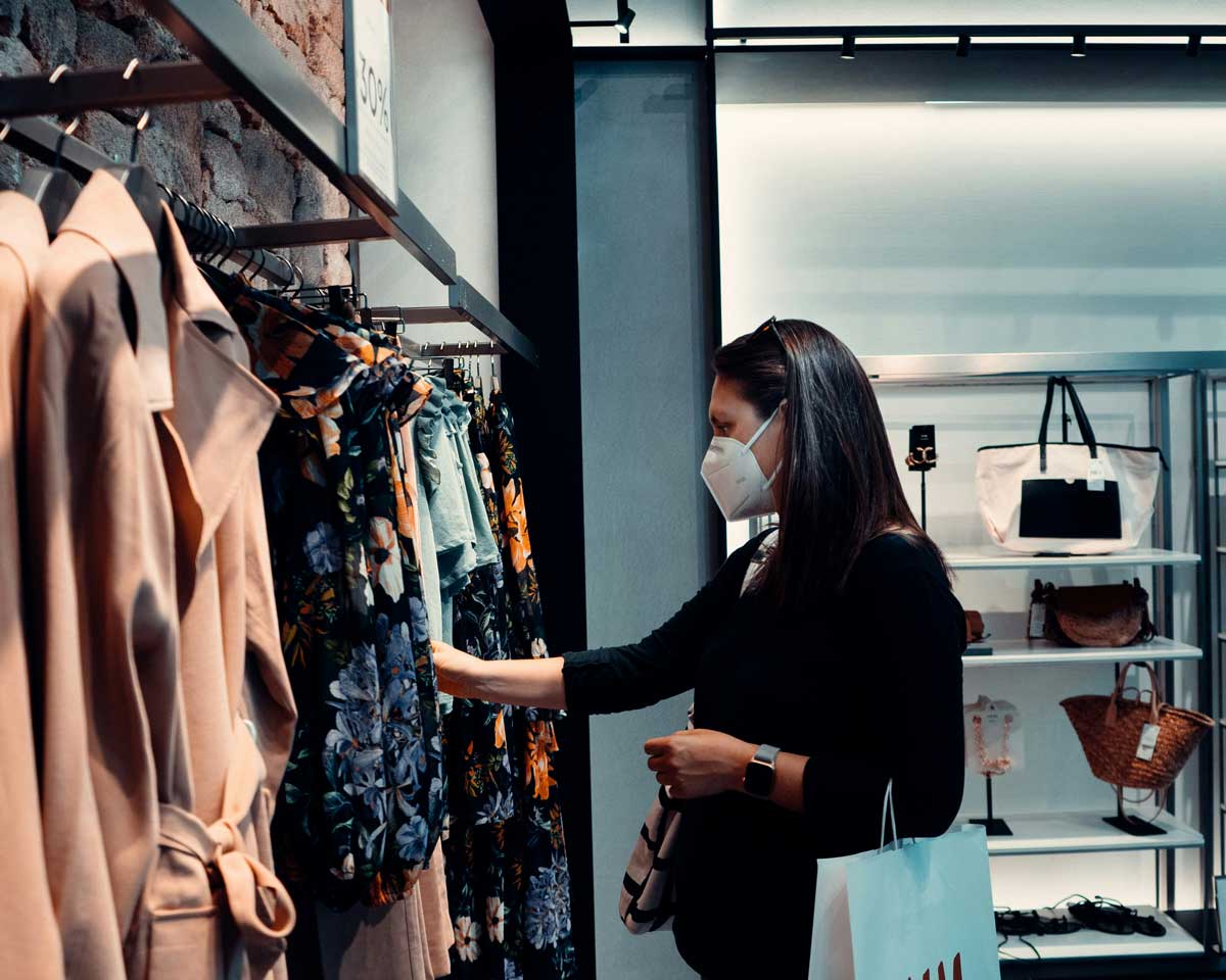 A Canadian shopping, wearing a face masque, due to air pollution.