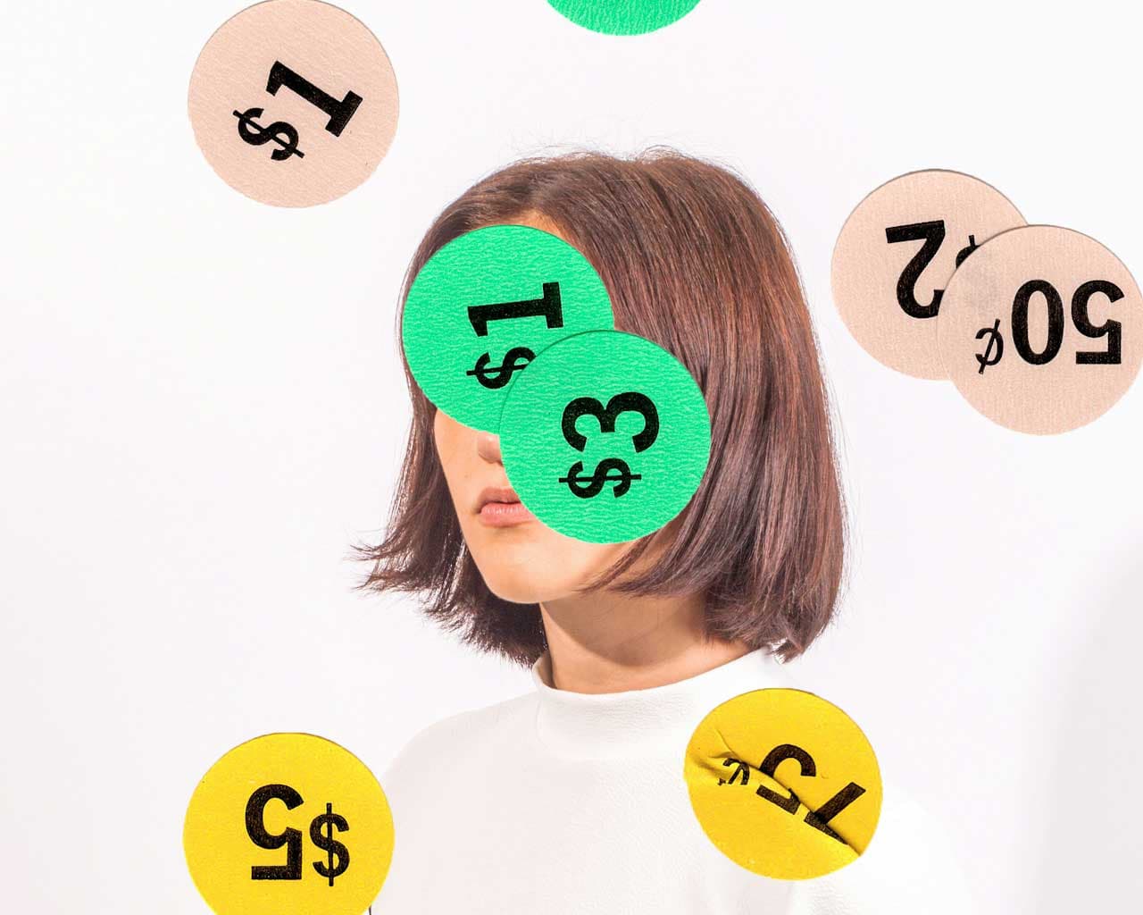 A woman's face covered by sale stickers of different prices and price changes to represent the algorithmic prices situation in Canada.