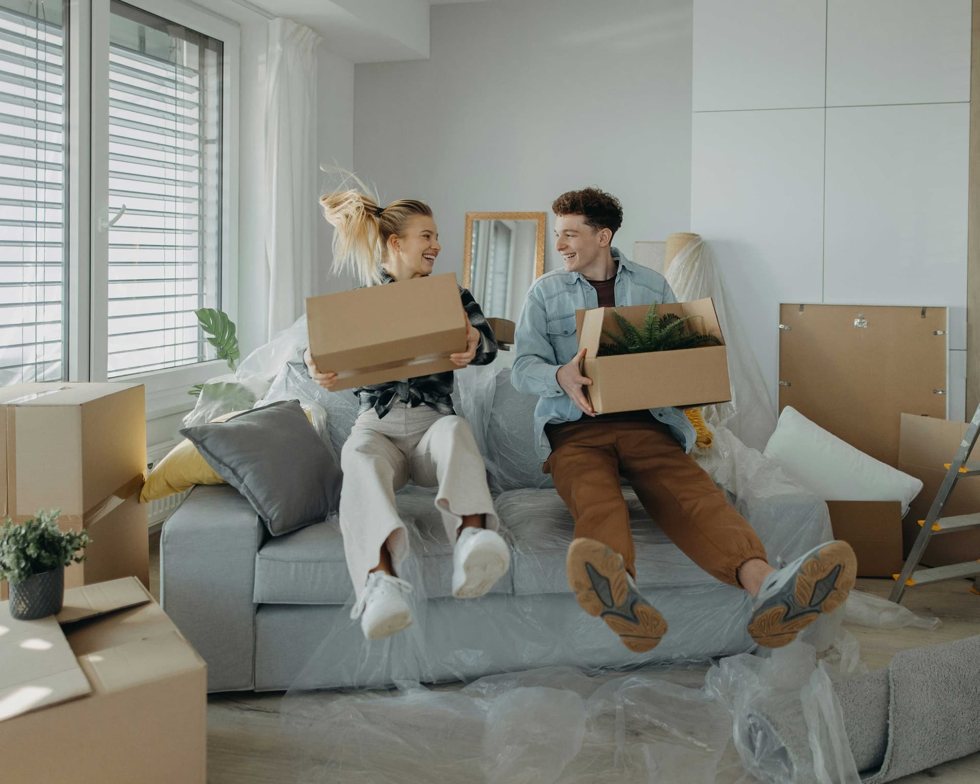 A Canadian couple moving in together, with new furniture and new expenses, wondering if they are living within their means.