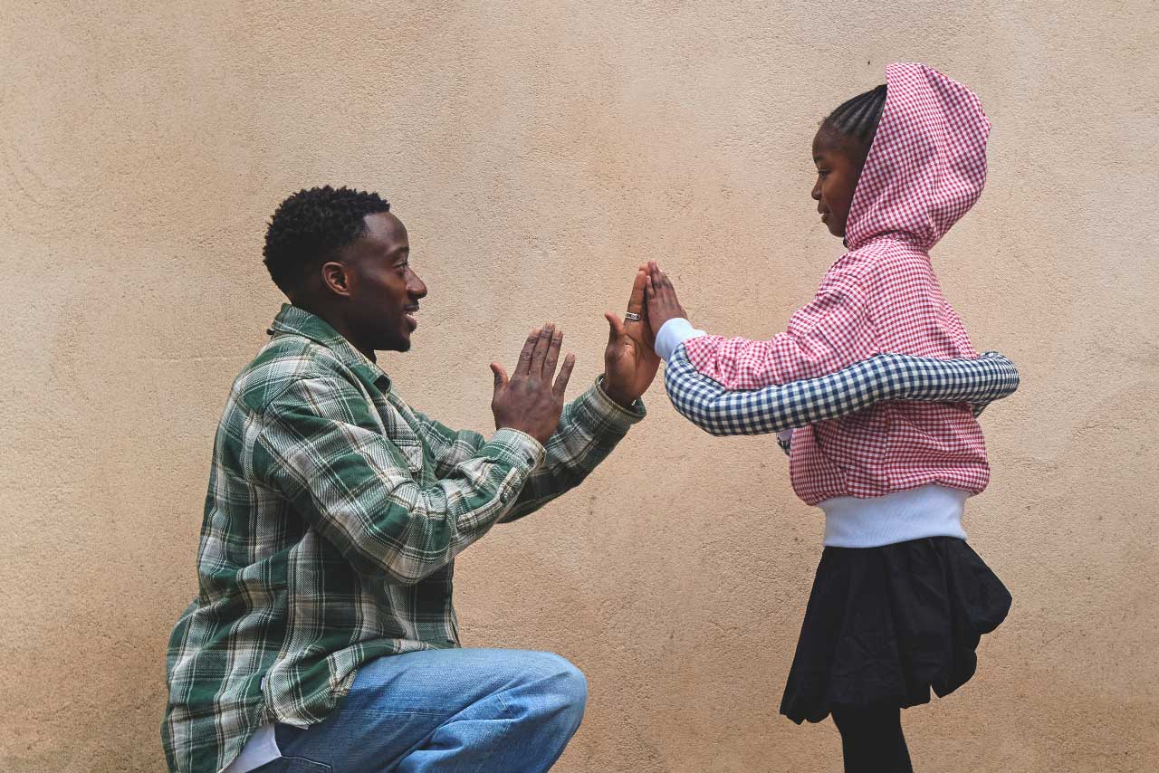 A Canadian father and daughter getting ready for school in fall clothes, despite the hot weather, thanks to back-to-school offers, which begs the question: Is it the best time to buy school supplies and clothes?