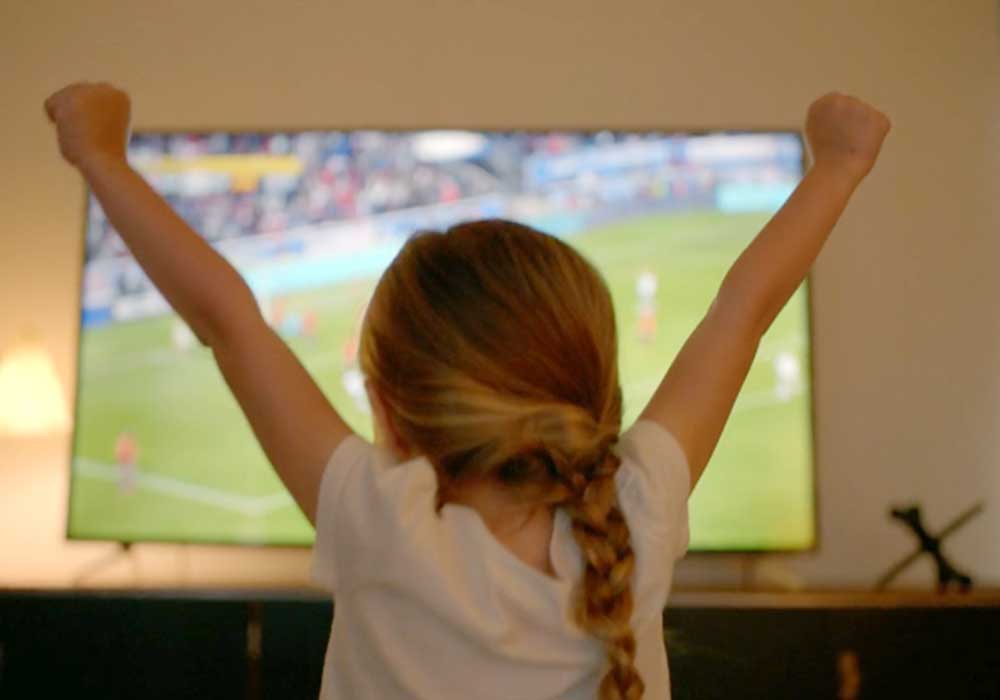 A very happy little girl, watching a free streaming event in Canada.