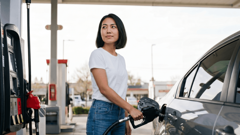 A person fuels up their car at a gas station, a transaction that can unlock cashback if paid for with the best gas credit card in Canada