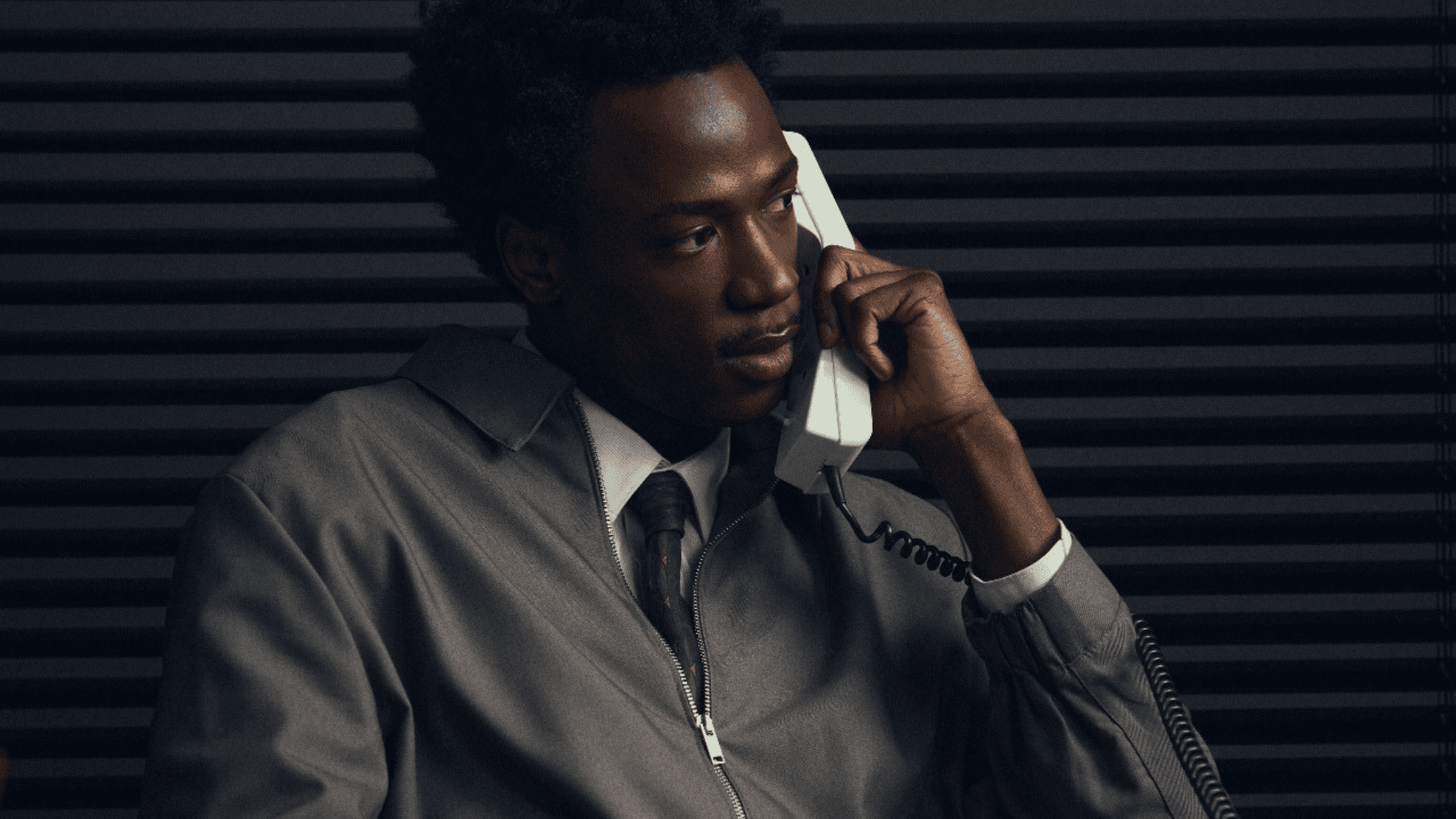 A person holding a phone to his ear, as he speaks to someone about Canadian bankruptcy exemptions and the surprising things he can keep during bankruptcy