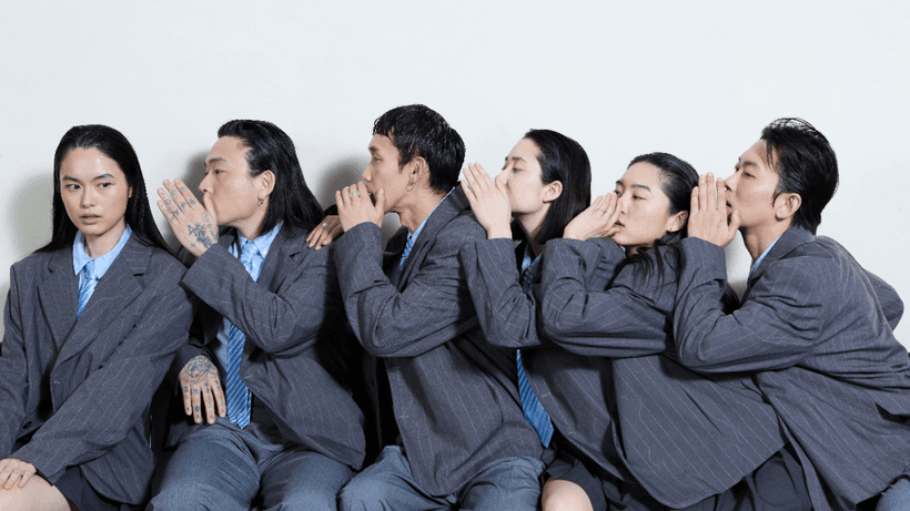 Six people sitting in a row, each one whispering into the next person's ear, symbolizing why Canadians lie about credit scores