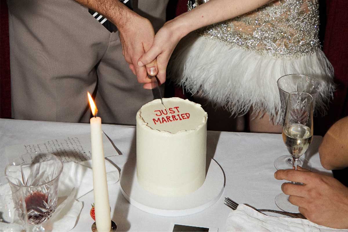 A wedding cake being cut by a Canadian couple to symbolize the splitting of assets after a divorce.