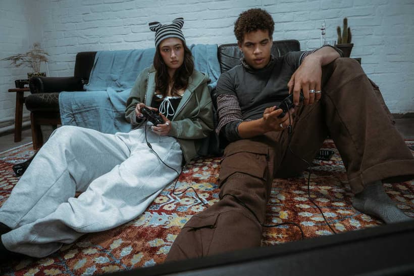 Two Canadians with retro clothes and playing video games, who participate in the risky business of hype buying and reselling.
