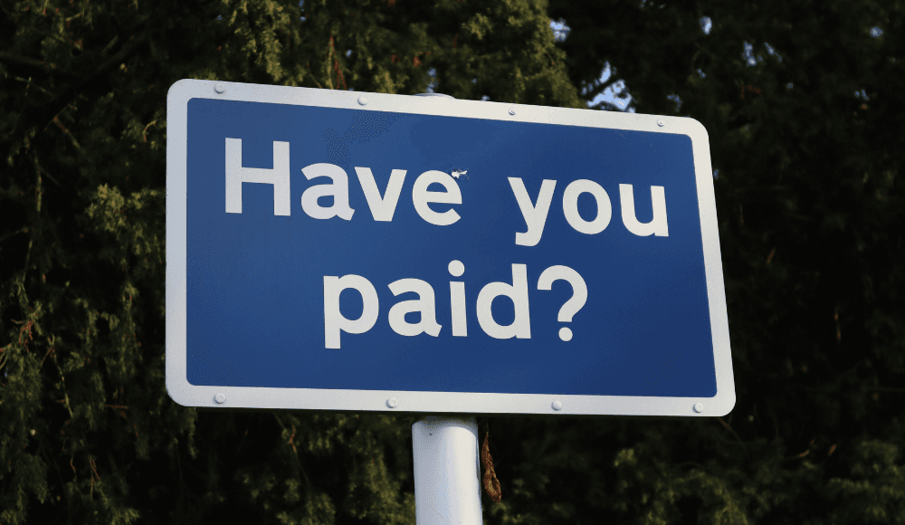 A sign displaying the words "Have you paid?"