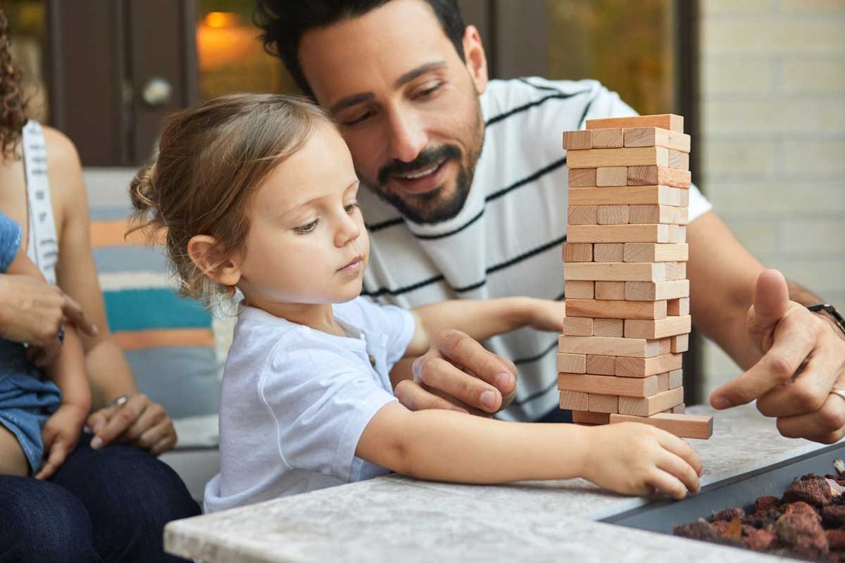 A Canadian dad advising his child how to play a game—but he’ll also give good money advice.