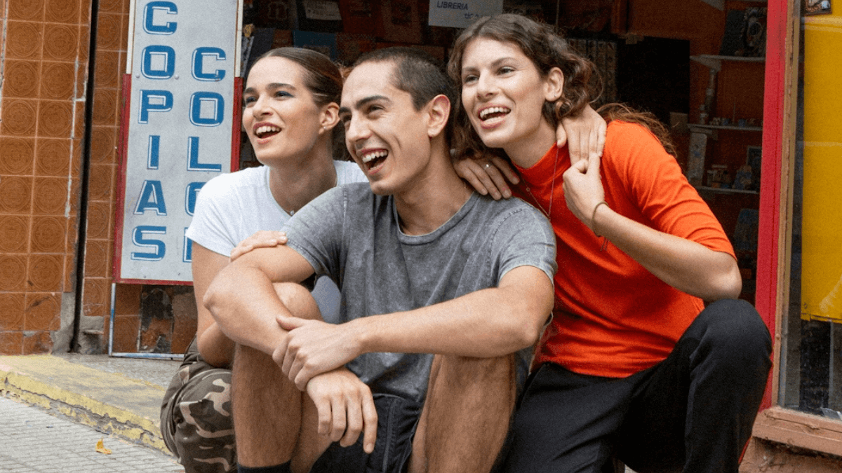 Best youth savings accounts in Canada: Three young friends smiling for a photo