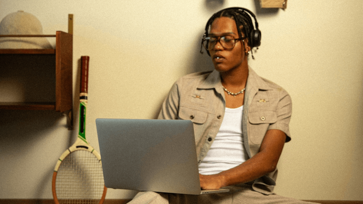 A person on their laptop, thinking about which of their things they can keep due to Canadian bankruptcy exemptions