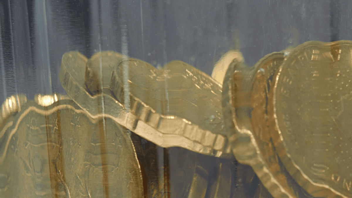 HISA ETFs: A jar of coins, symbolizing high-interest savings