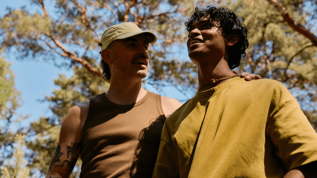 Two people standing next to each other outdoors, contemplating opening a joint bank account in Canada
