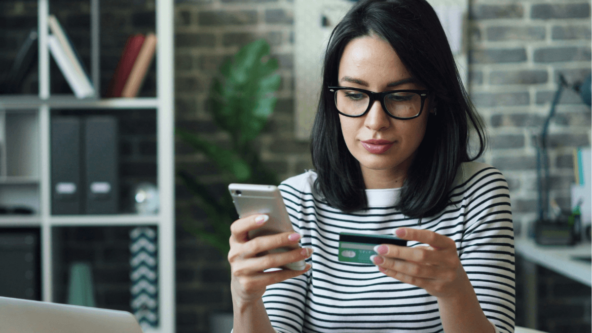 A Canadian with an instant approval credit card and a phone in hand