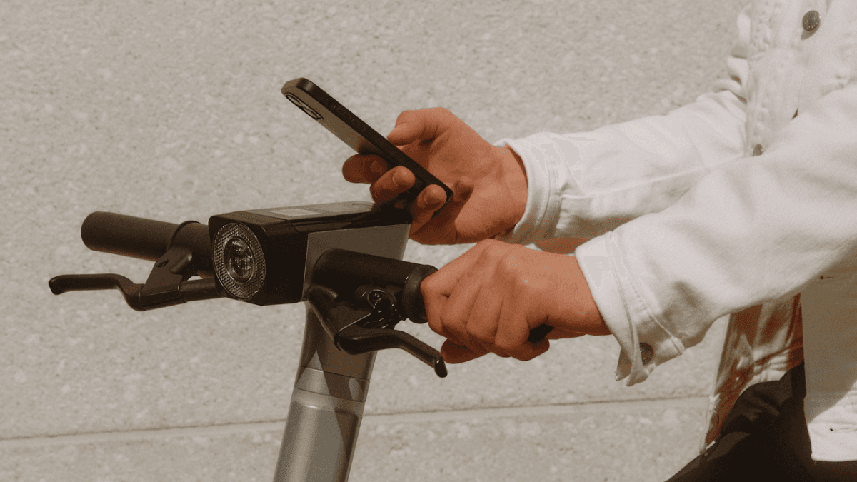 A person accessing a frozen bank account in Canada via their mobile phone