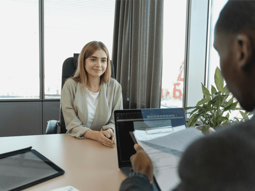 A Canadian woman being told she is getting a promotion at work, and she's hoping that earning more will help her save more.