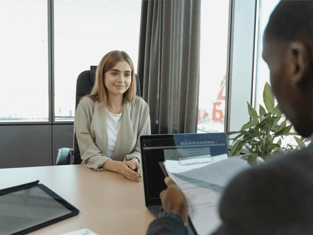 A Canadian woman being told she is getting a promotion at work, and she's hoping that earning more will help her save more.