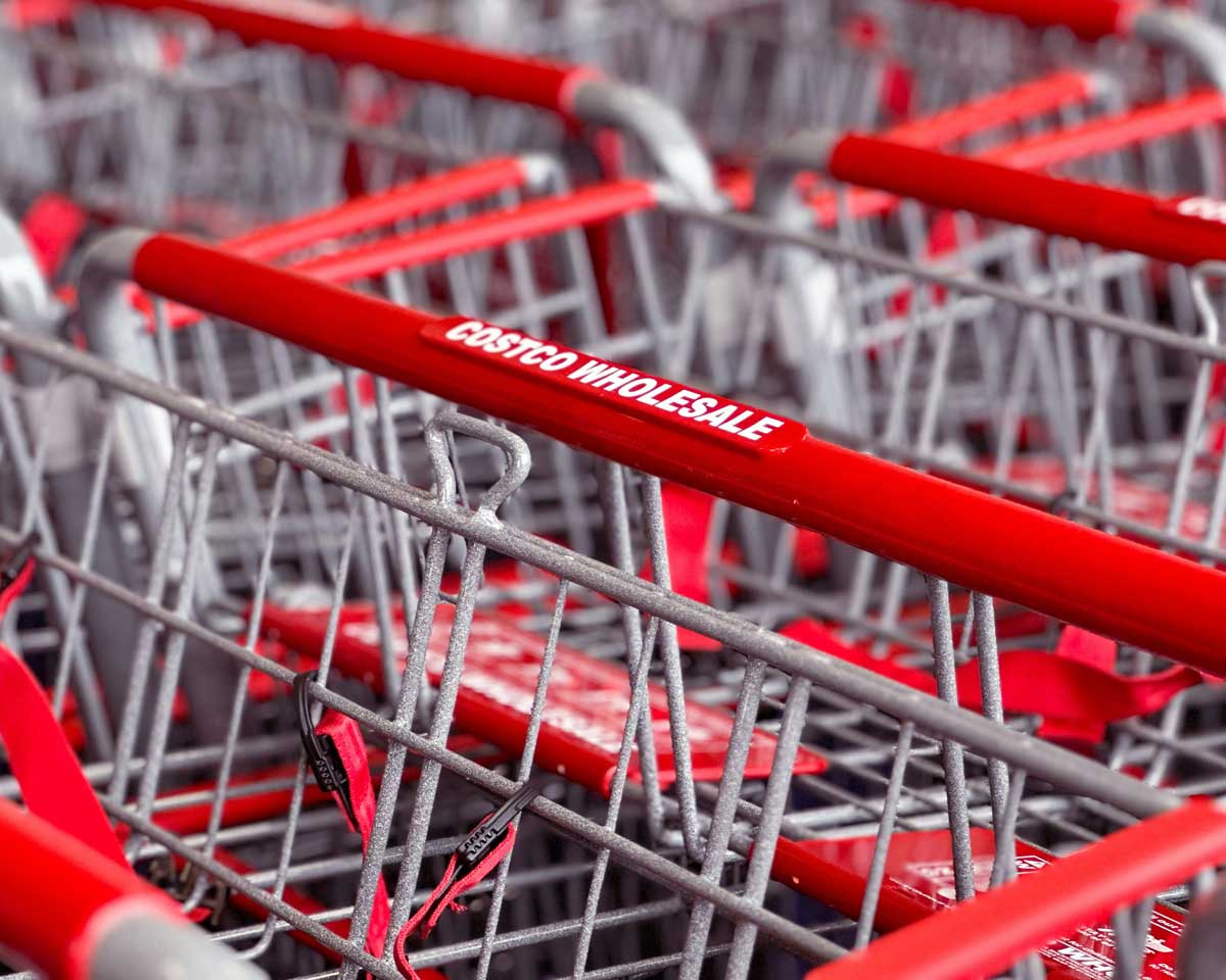 Costco grocery carts outside a Canadian location, where deals are often found inside.