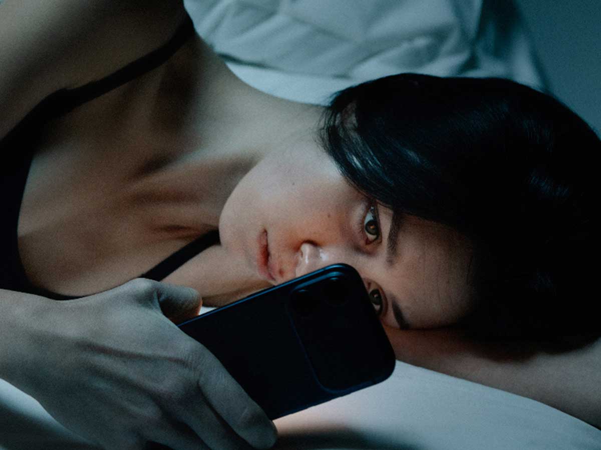 A young Canadian, up late at night, reading and worrying about Canada's debt.