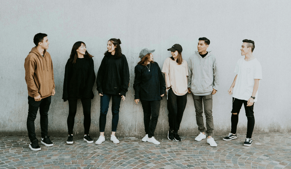 A group of young people talking to each other